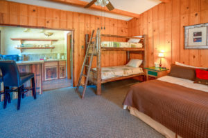 West-Beckwith-Cabin-–-King-Bed-Twin-bunkbeds-and-kitchen-300x200.jpg